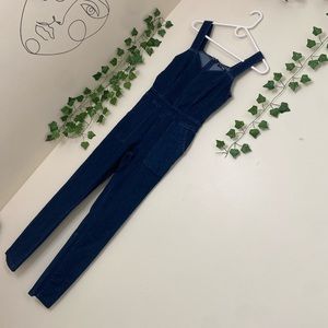 Denim jumpsuit, very stylish and can be dressed up or down.